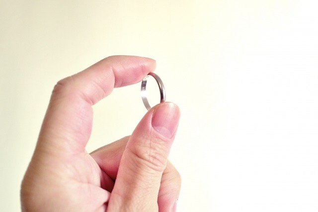 Hand holding a ring